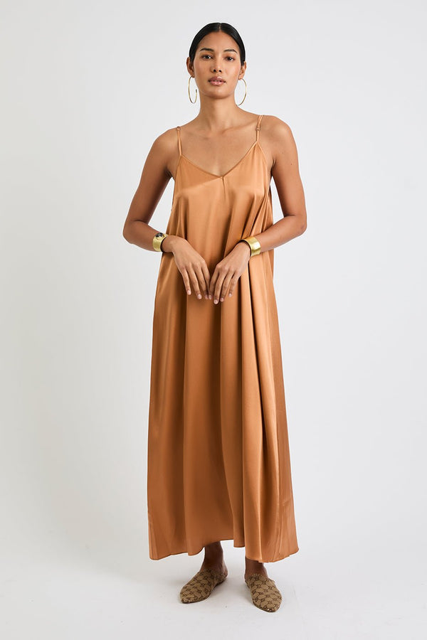 Model wearing Julie silk maxi dress in Copper