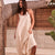 Model wearing Julie silk maxi dress in Latte (beige)