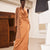 Model wearing the Naomi silk skirt in Copper