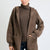 Model wearing Vivi cropped cashmere coat with hood in Mocha
